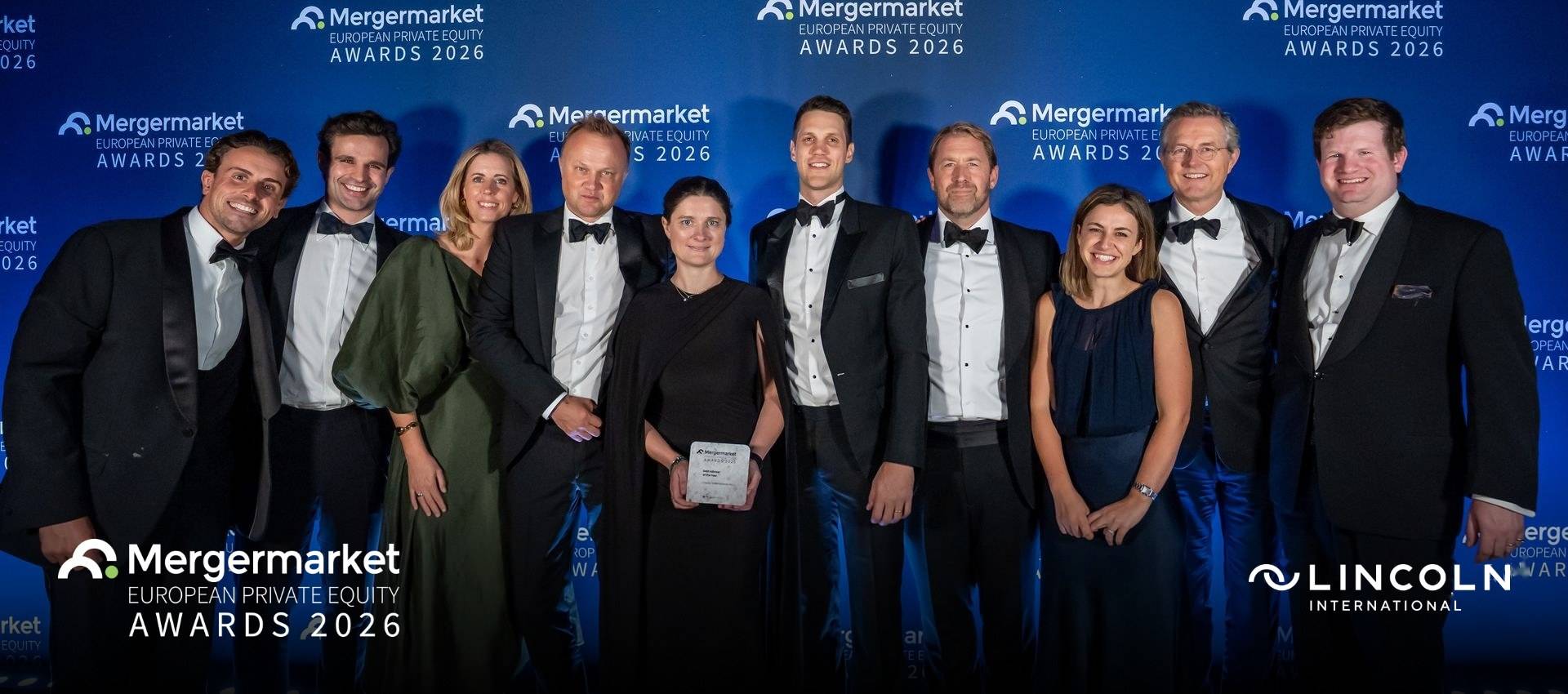 Members of Lincoln International's European Capital Advisory team in black tie in front of the Mergermarket European Private Equity Awards 2026 backdrop, one holding the Debt Advisor of the Year award